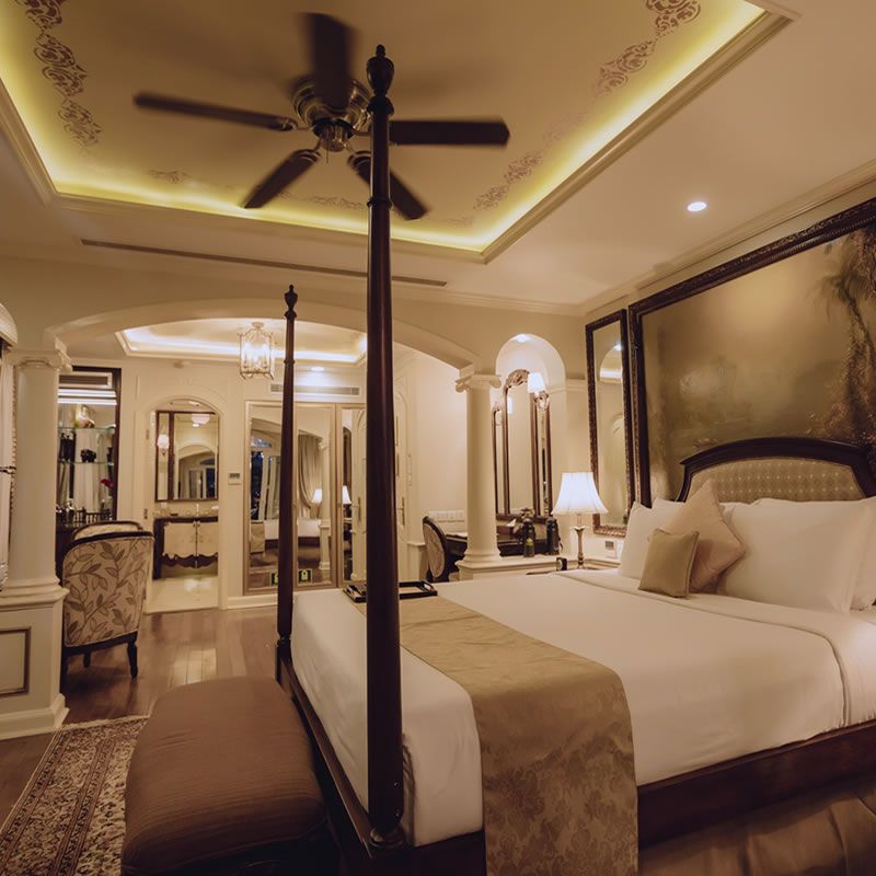 Angkor Suite four-poster bed and sitting area